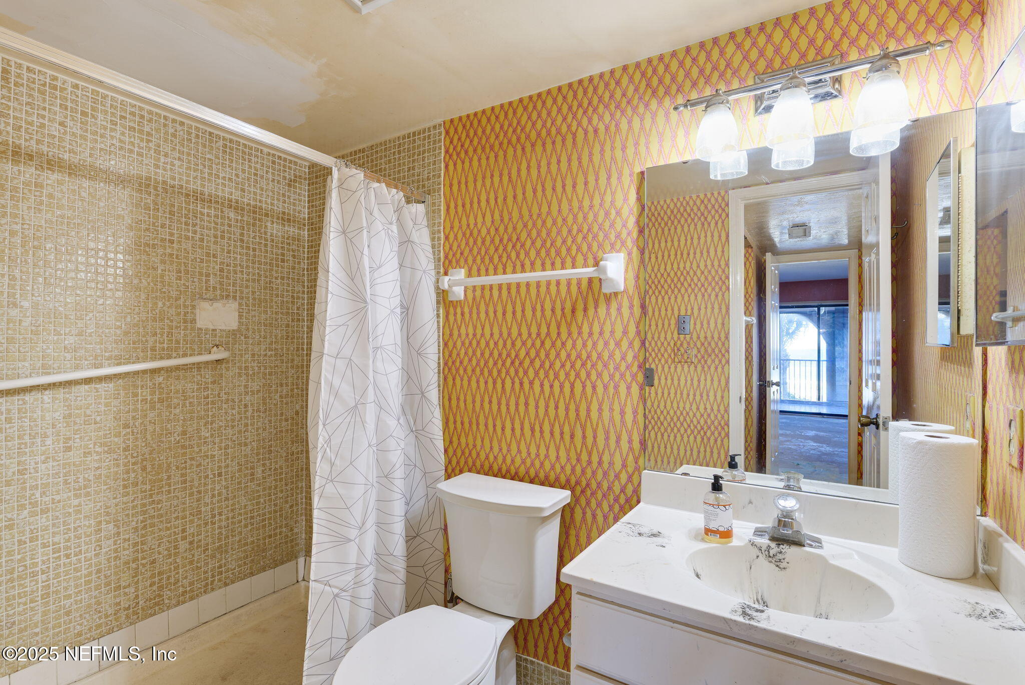 10 10th Street, Unit 2 Atlantic Beach, FL 32233 - Photo 24 of 43 a bathroom with a sink toilet and shower