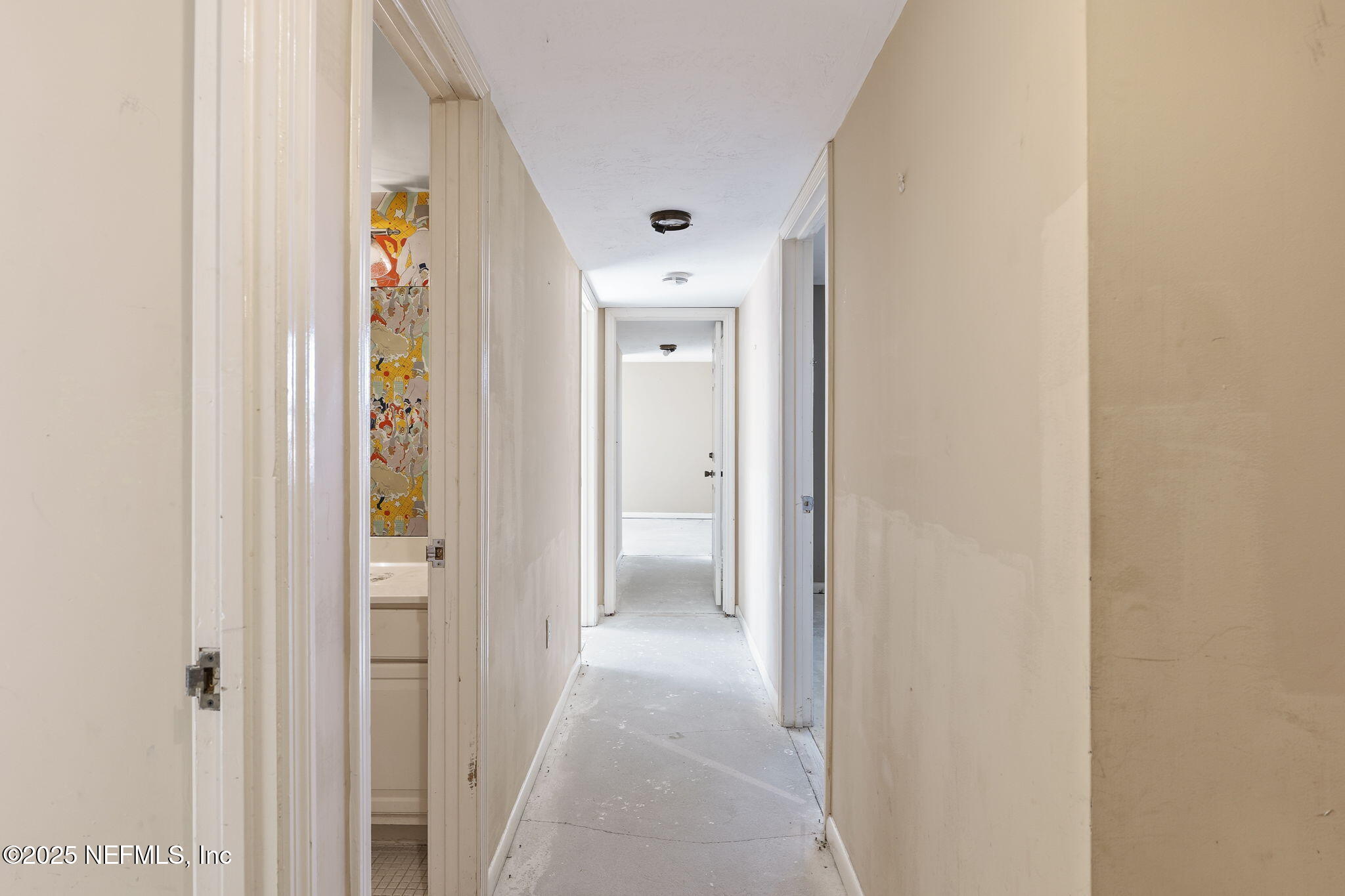 10 10th Street, Unit 2 Atlantic Beach, FL 32233 - Photo 28 of 43 a view of a hallway with wooden floor and closet