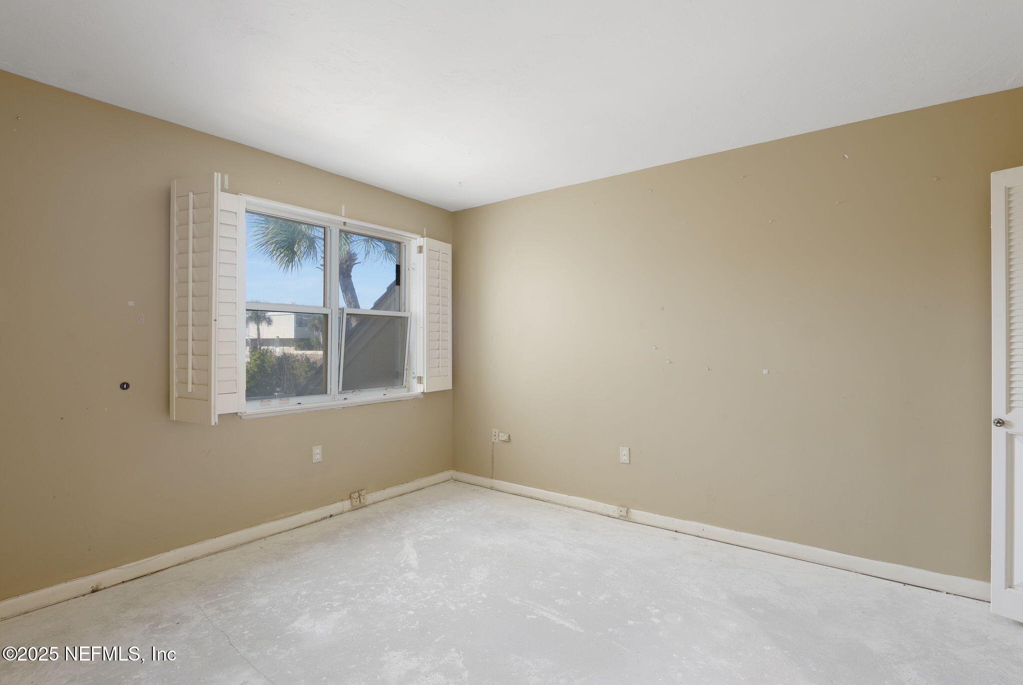 10 10th Street, Unit 2 Atlantic Beach, FL 32233 - Photo 28 of 41 a view of an empty room with a window