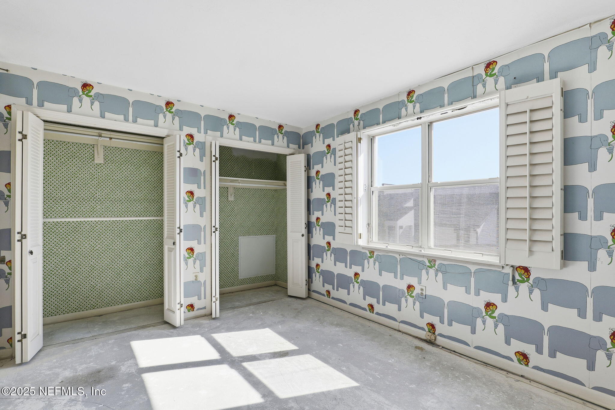 10 10th Street, Unit 2 Atlantic Beach, FL 32233 - Photo 33 of 43 a view of an empty room with a window