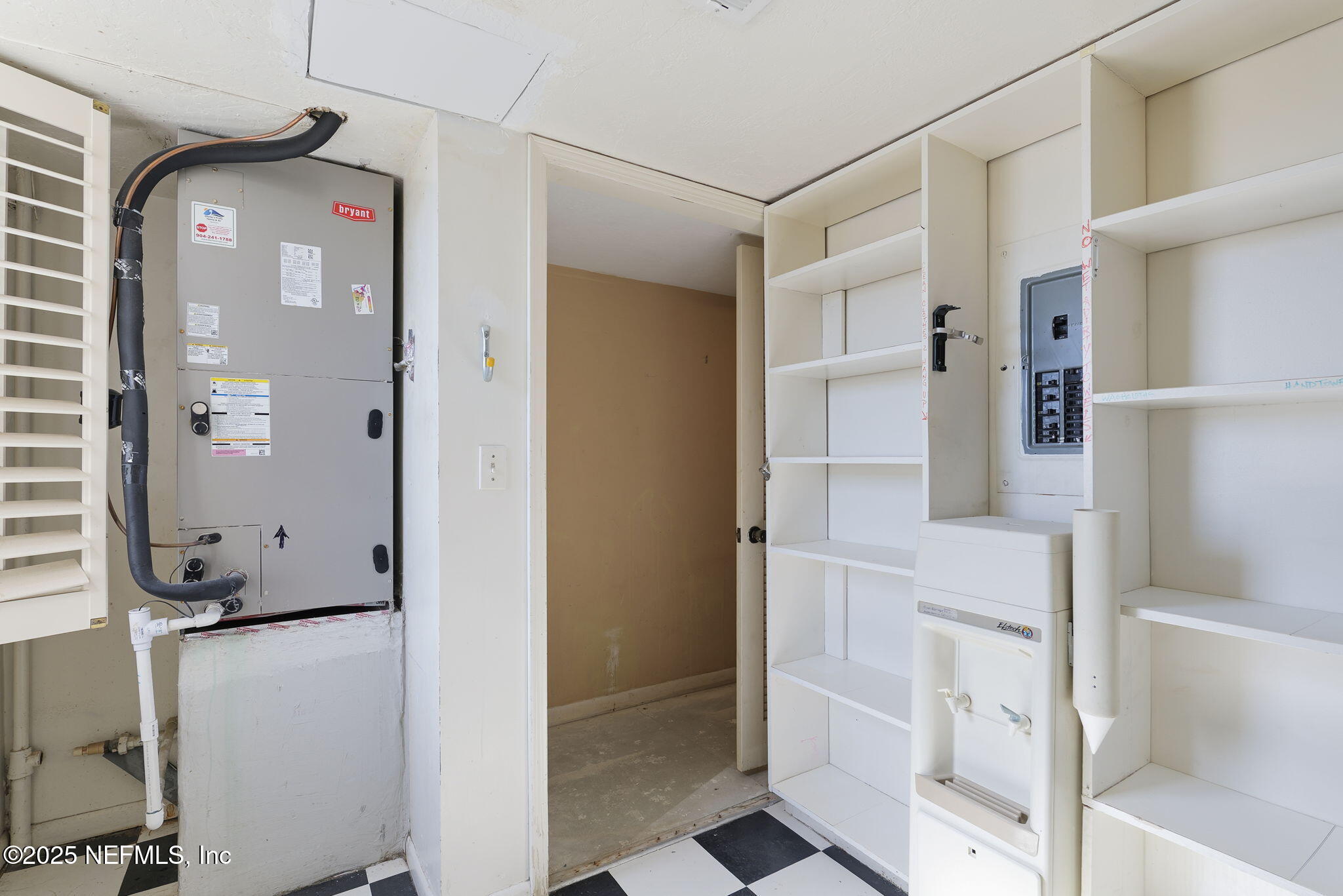 10 10th Street, Unit 2 Atlantic Beach, FL 32233 - Photo 36 of 41 a view of walk in closet with empty racks