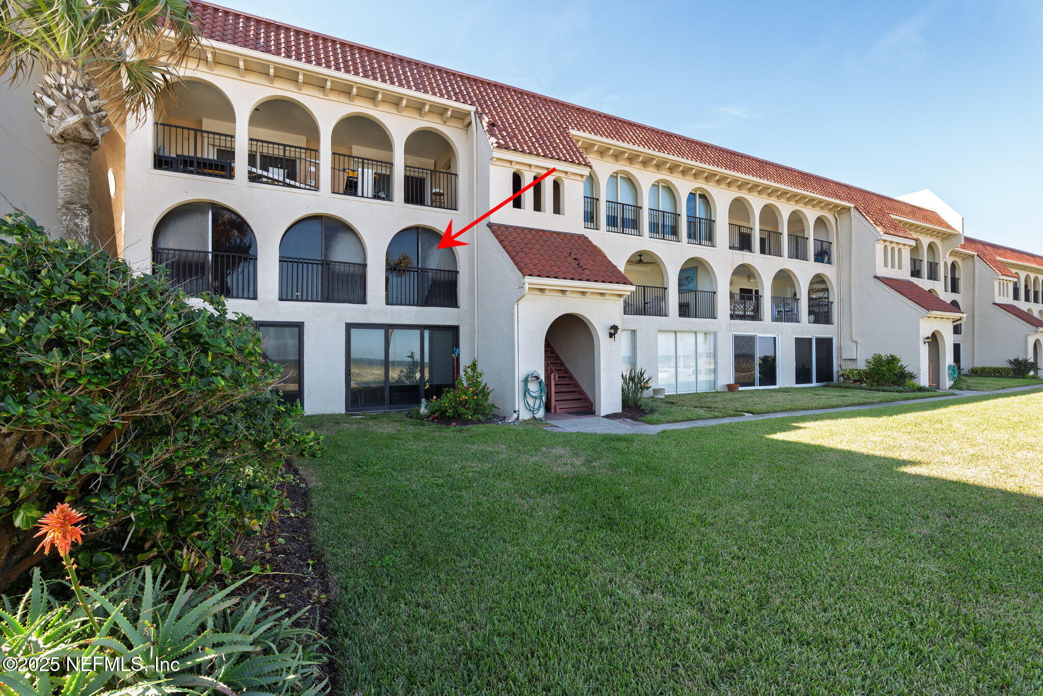 10 10th Street, Unit 2 Atlantic Beach, FL 32233 - Photo 40 of 41 a front view of a building with garden