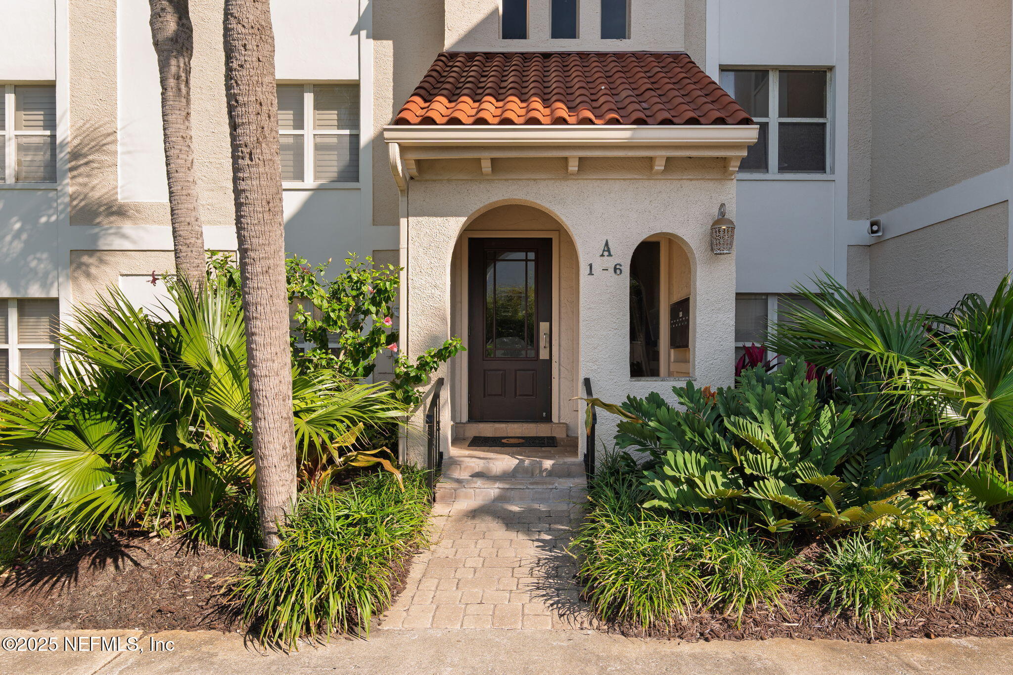 10 10th Street, Unit 2 Atlantic Beach, FL 32233 - Photo 9 of 43 a view of a house with potted plants