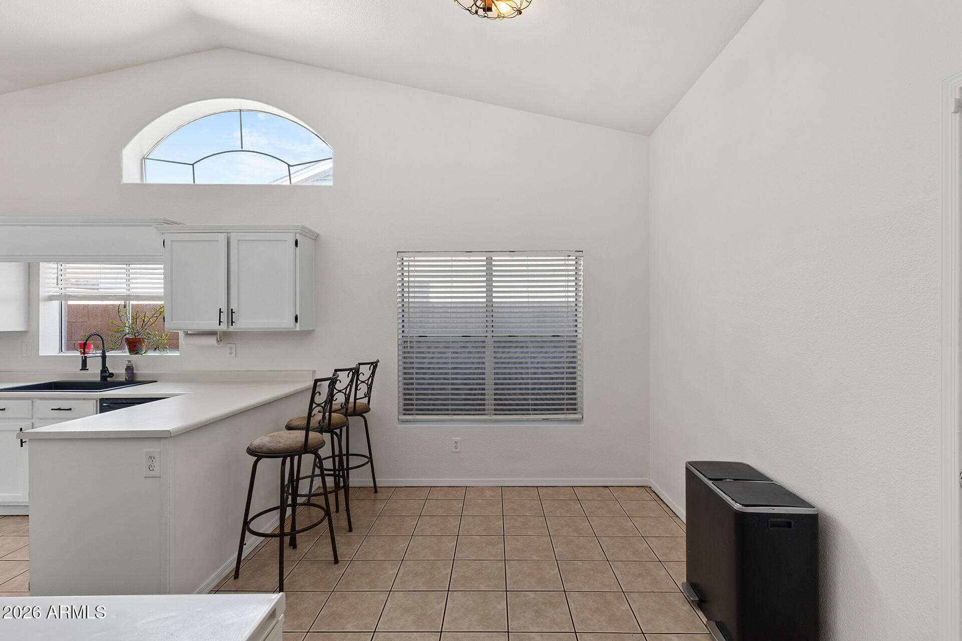 9002 West Coronado Road Phoenix, AZ 85037 - Photo 11 of 54 a view of a dining room with furniture and wooden floor