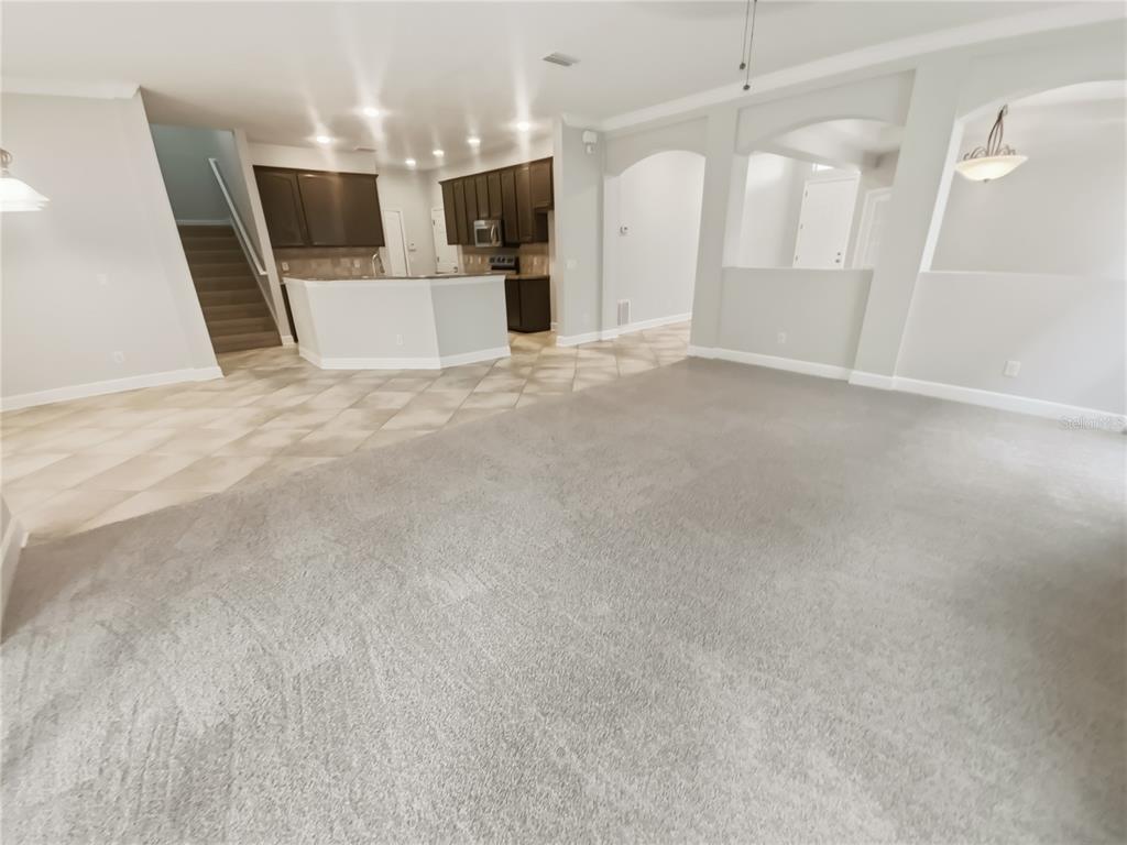 4307 Rustic Pine Place Wesley Chapel, FL 33544 - Photo 13 of 38 a view of a livingroom with a furniture and a flat screen tv