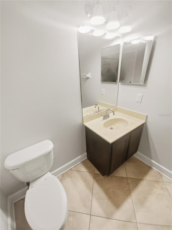 4307 Rustic Pine Place Wesley Chapel, FL 33544 - Photo 15 of 38 a bathroom with a toilet sink and mirror