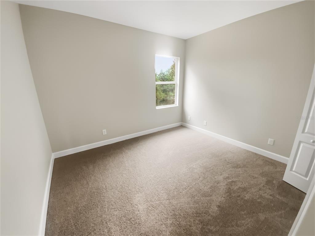 4307 Rustic Pine Place Wesley Chapel, FL 33544 - Photo 19 of 38 an empty room with a window