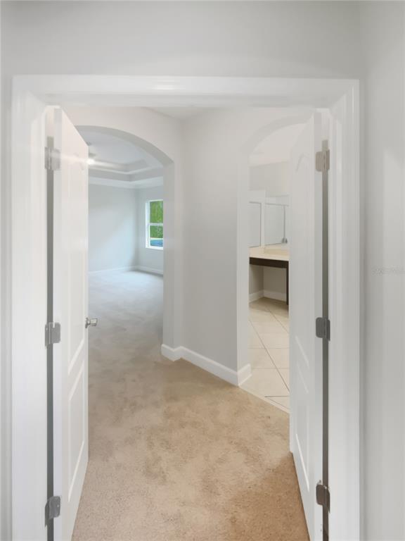 4307 Rustic Pine Place Wesley Chapel, FL 33544 - Photo 21 of 38 a view of a hallway to rooms and stairs