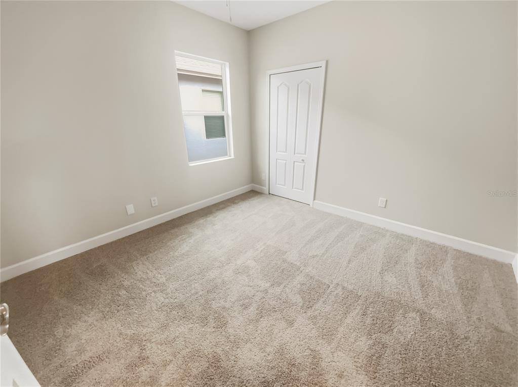 4307 Rustic Pine Place Wesley Chapel, FL 33544 - Photo 28 of 38 an empty room with windows and closet