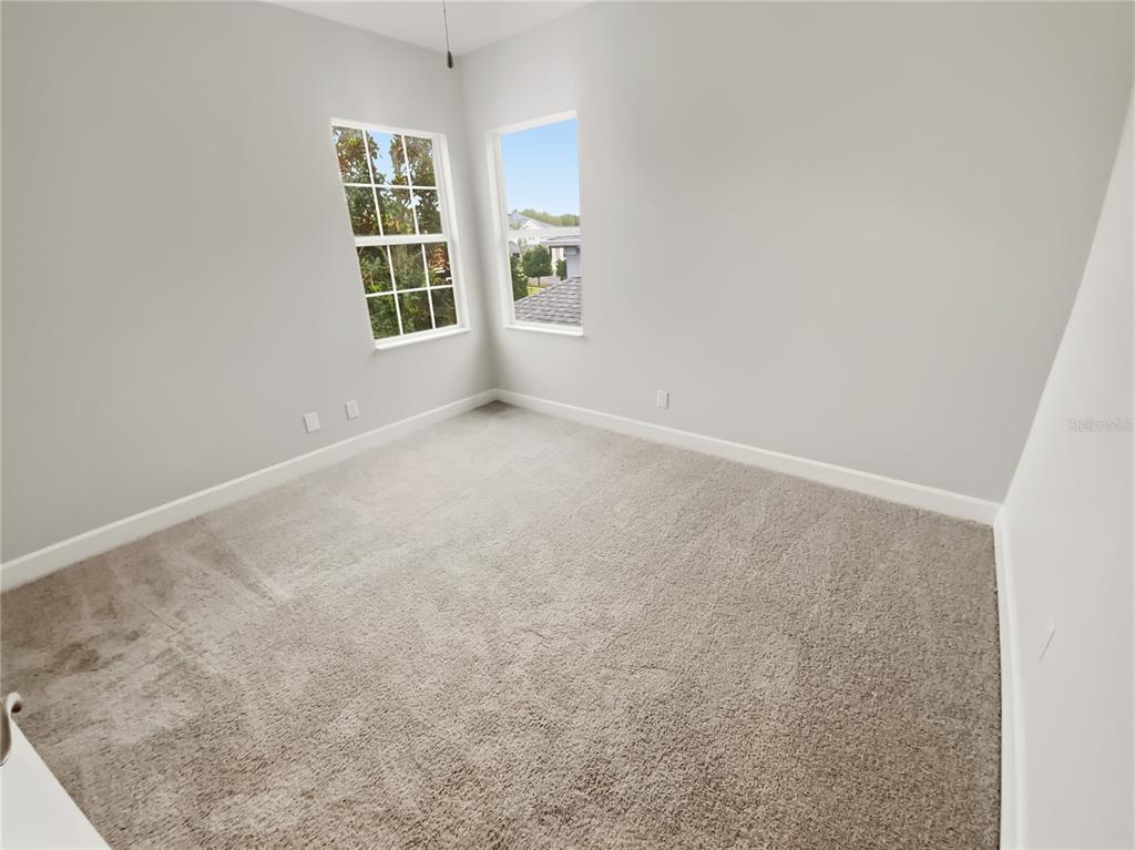 4307 Rustic Pine Place Wesley Chapel, FL 33544 - Photo 29 of 38 an empty room with windows