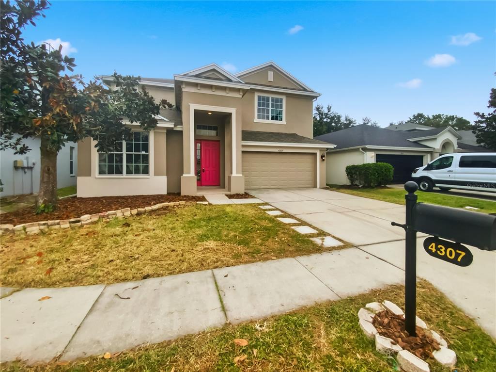4307 Rustic Pine Place Wesley Chapel, FL 33544 - Photo 37 of 38 a front view of a house with entertaining space