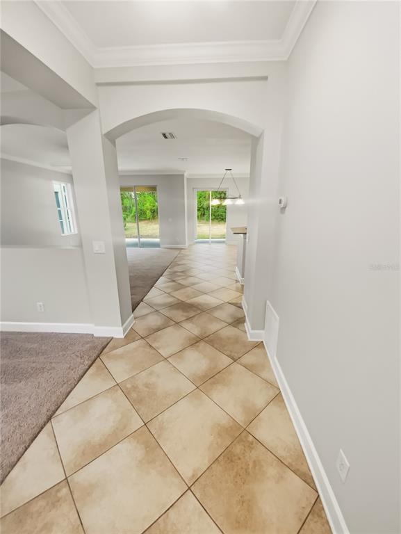 4307 Rustic Pine Place Wesley Chapel, FL 33544 - Photo 9 of 38 a view of entryway with wooden floor and window