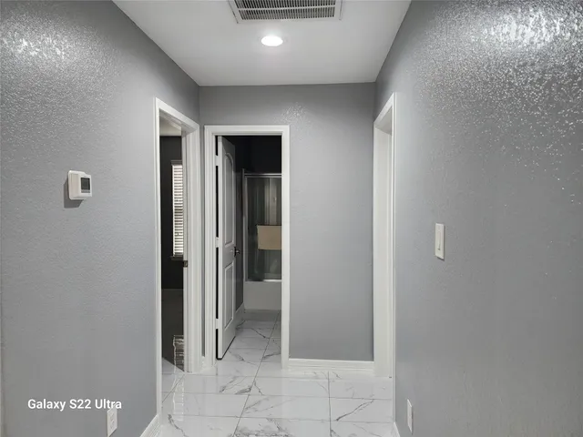 a bathroom with a bathtub and a sink