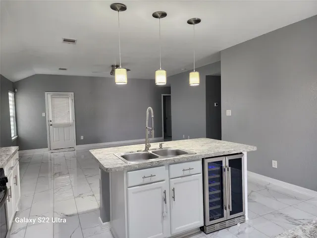 a bathroom with a sink vanity and mirror