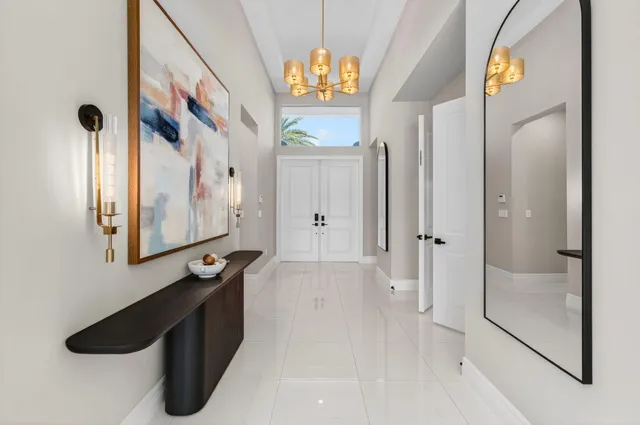 a bedroom with a large bed and a flat screen tv