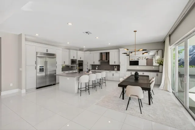 a bedroom with a bed wooden floor and window