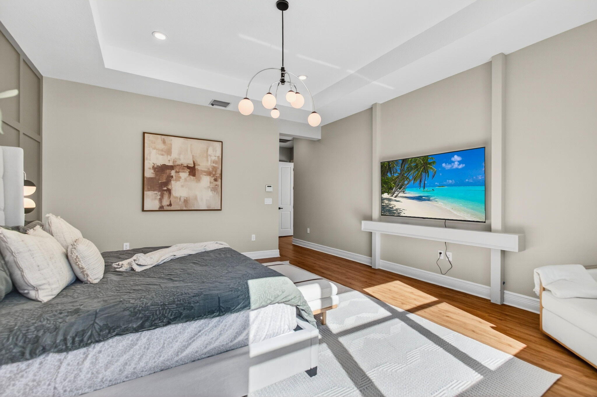 19886 Meadowside Lane Boca Raton, FL 33498 - Photo 25 of 84 a bedroom with a large bed and a flat screen tv