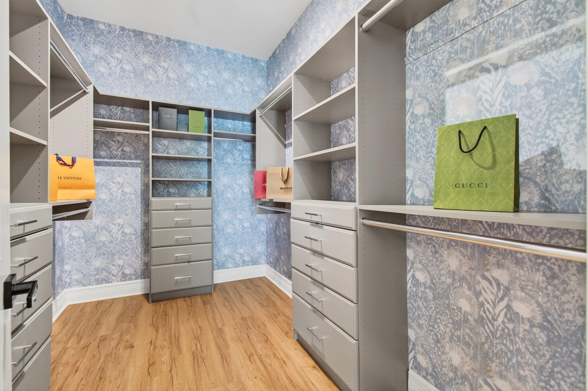 19886 Meadowside Lane Boca Raton, FL 33498 - Photo 27 of 84 a view of walk in closet with clothes and shoes