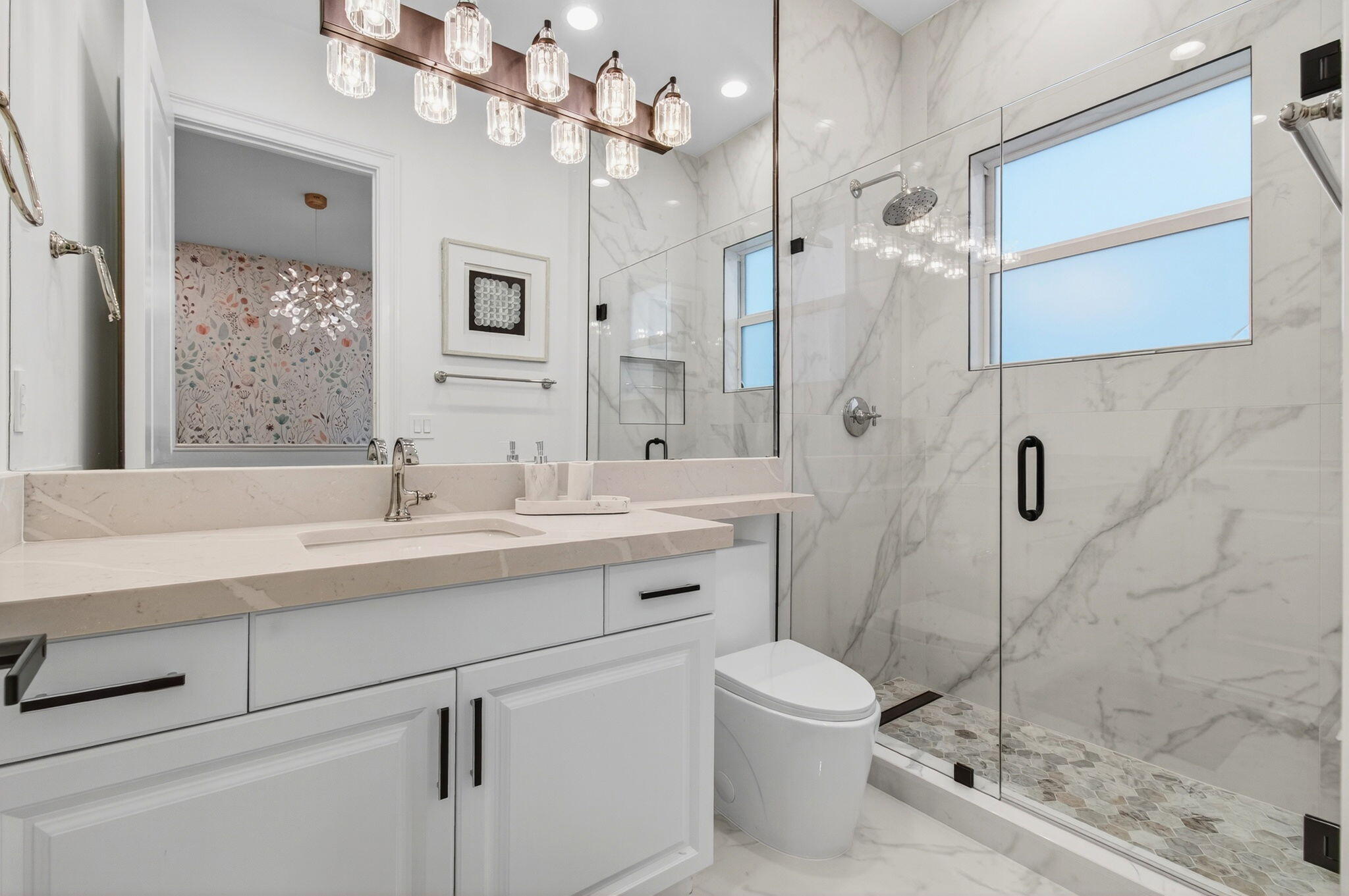 19886 Meadowside Lane Boca Raton, FL 33498 - Photo 40 of 84 a bathroom with a sink a toilet a mirror and shower