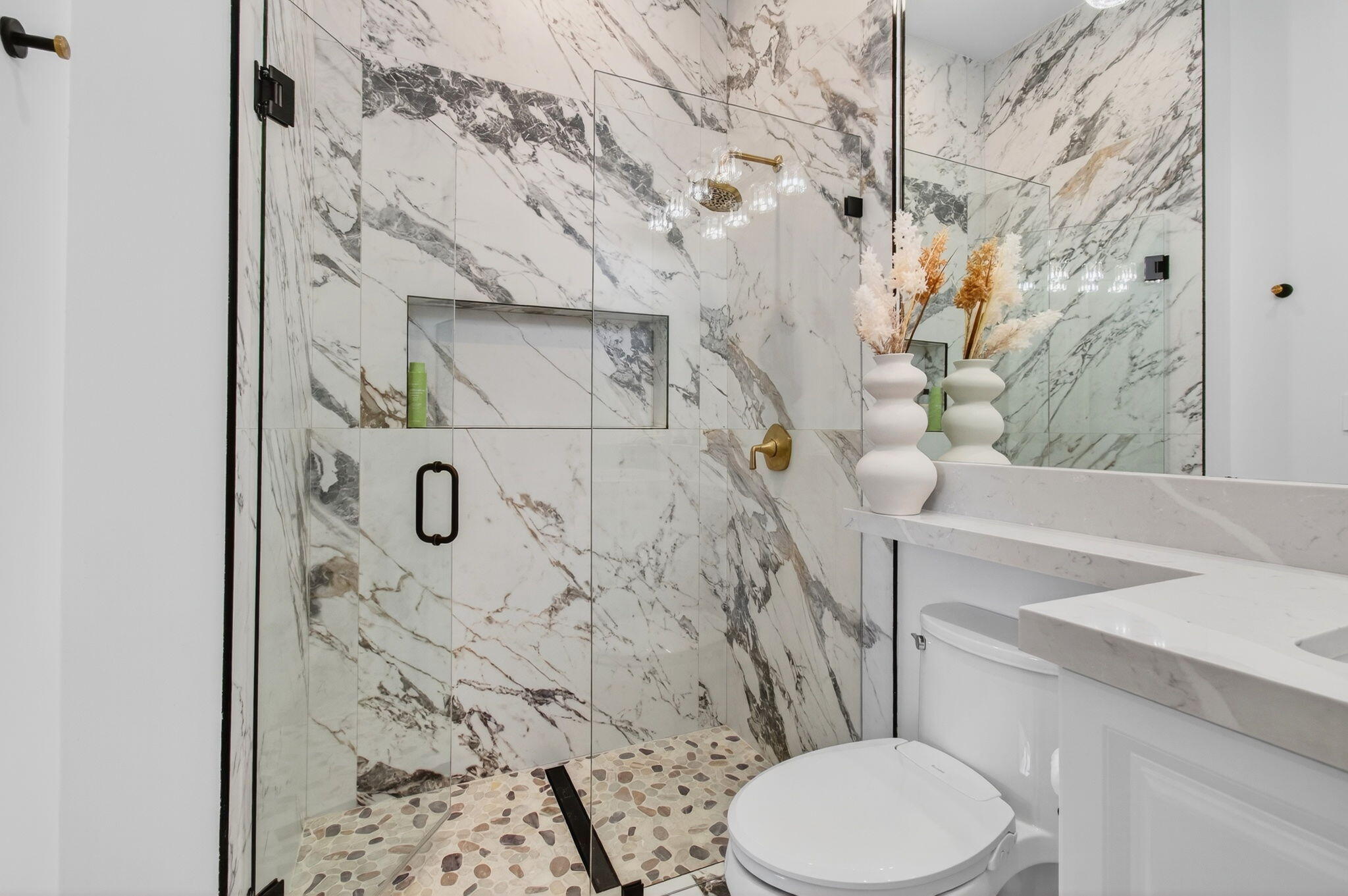 19886 Meadowside Lane Boca Raton, FL 33498 - Photo 46 of 84 a white toilet sitting next to a bathroom sink