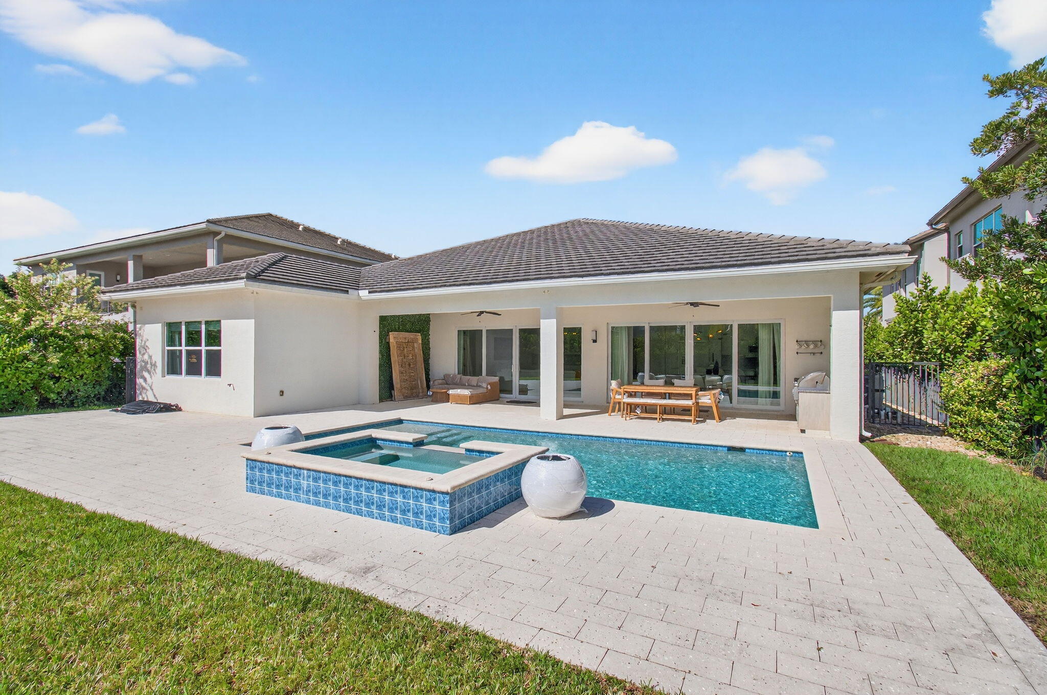 19886 Meadowside Lane Boca Raton, FL 33498 - Photo 55 of 84 a front view of house with yard and outdoor seating