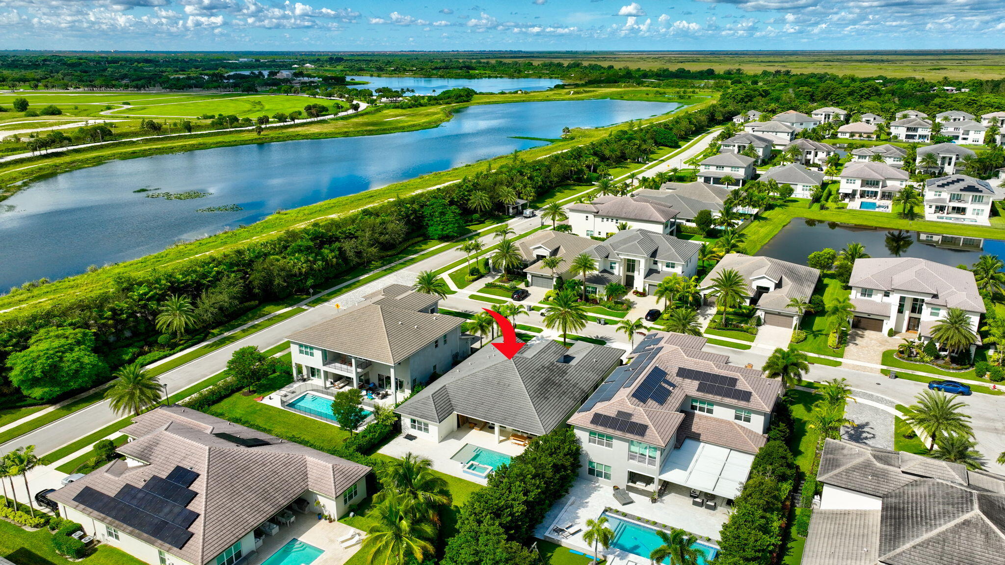 19886 Meadowside Lane Boca Raton, FL 33498 - Photo 59 of 84 an aerial view of a city with lots of residential buildings ocean and mountain view in back