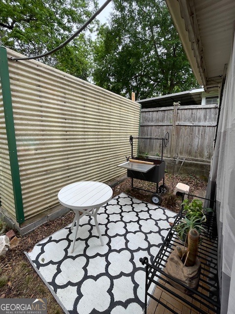311 3rd Street Manchester, GA 31816 - Photo 48 of 62 a view of a backyard with a chair and a fire pit