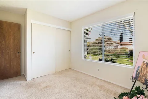 a view of a room that has a window in it