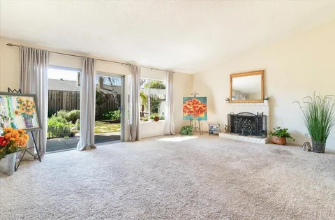 an empty room with furniture and a fireplace