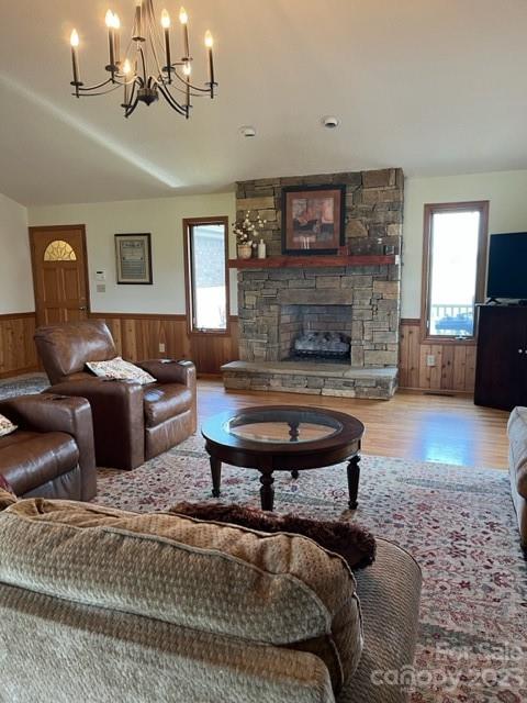 7100 Highway 108 Mill Spring, NC 28756 - Photo 11 of 48 a living room with furniture a fireplace and a chandelier