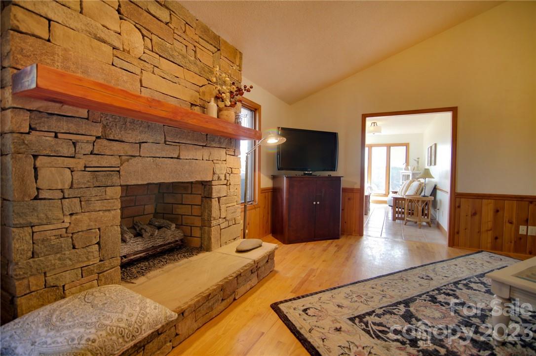 7100 Highway 108 Mill Spring, NC 28756 - Photo 12 of 48 a kitchen with stainless steel appliances kitchen island granite countertop a stove and a wooden cabinets