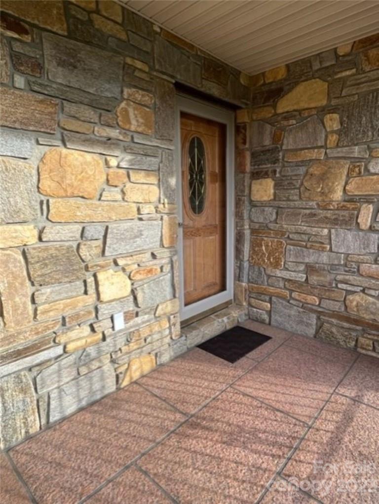 7100 Highway 108 Mill Spring, NC 28756 - Photo 13 of 48 a view of front door of house with glass door