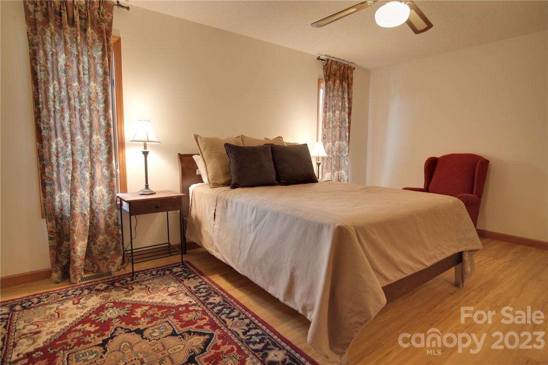 7100 Highway 108 Mill Spring, NC 28756 - Photo 30 of 48 a bedroom with a bed and a window