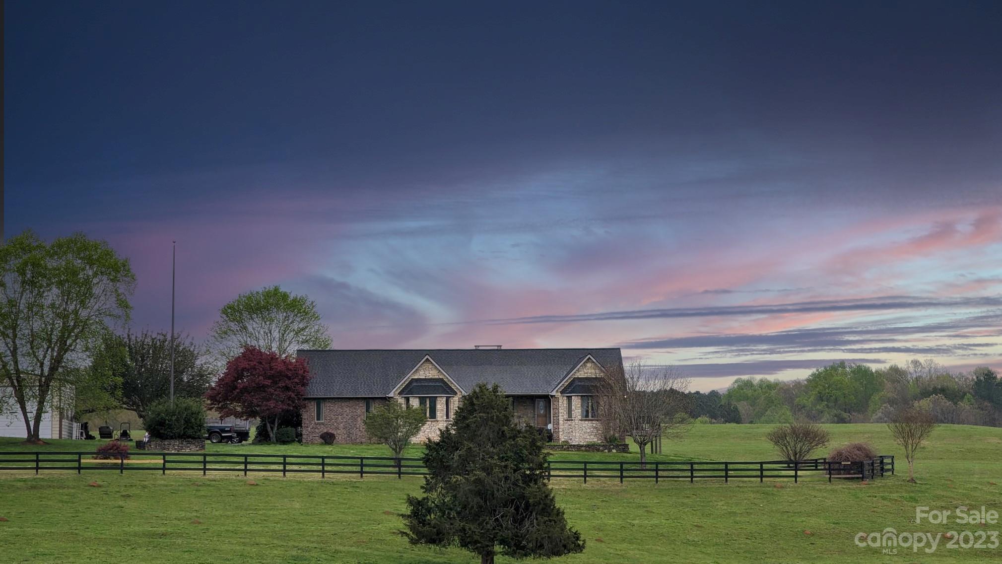 7100 Highway 108 Mill Spring, NC 28756 - Photo 3 of 48 a view of a house with a garden