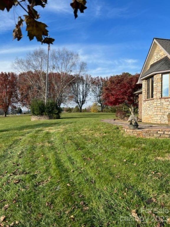 7100 Highway 108 Mill Spring, NC 28756 - Photo 33 of 48 a view of a house with a yard