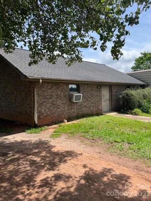 7100 Highway 108 Mill Spring, NC 28756 - Photo 34 of 48 a front view of a house with a yard