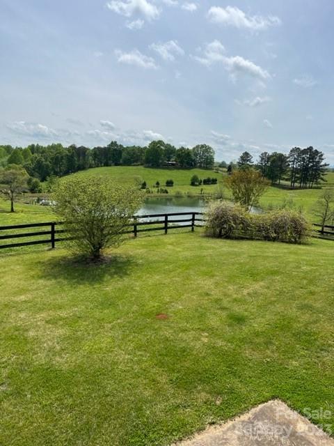 7100 Highway 108 Mill Spring, NC 28756 - Photo 38 of 48 a view of a lake with houses in the back