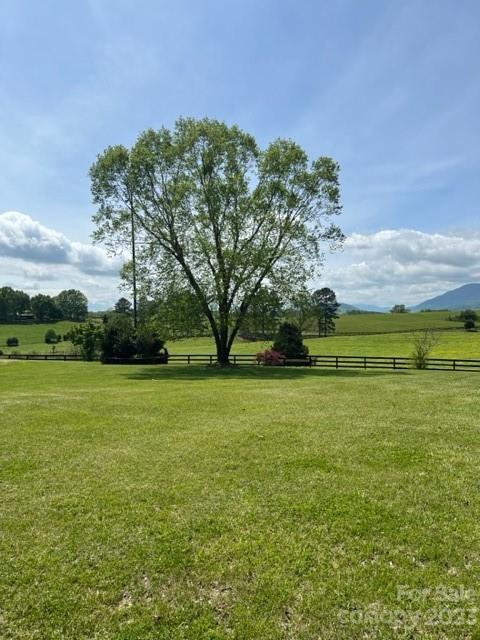 7100 Highway 108 Mill Spring, NC 28756 - Photo 39 of 48 a view of a field of grass and trees