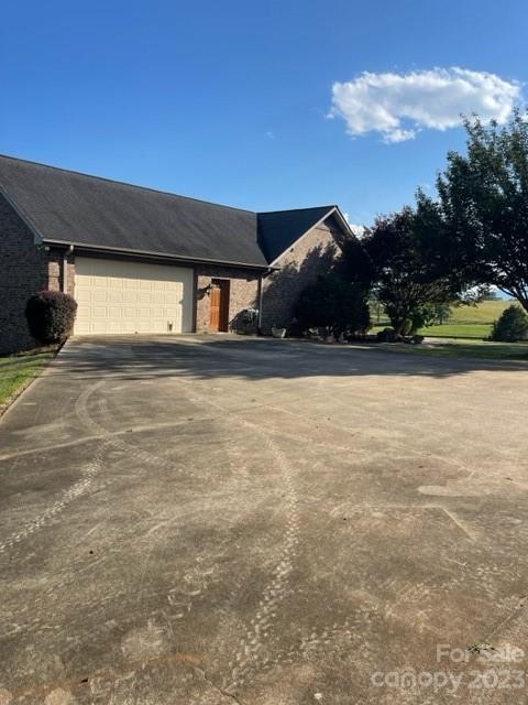 7100 Highway 108 Mill Spring, NC 28756 - Photo 45 of 48 a view of a house with a yard