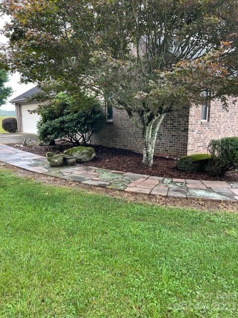 7100 Highway 108 Mill Spring, NC 28756 - Photo 46 of 48 a view of a backyard with plants and large trees