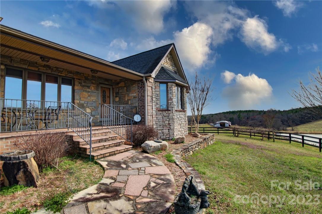 7100 Highway 108 Mill Spring, NC 28756 - Photo 6 of 48 a view of house with yard and furniture