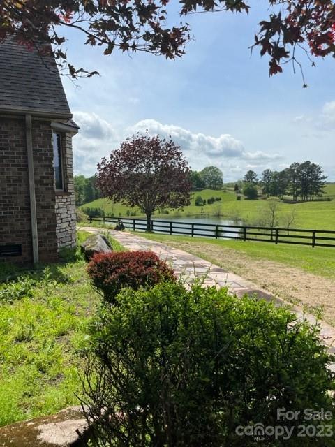 7100 Highway 108 Mill Spring, NC 28756 - Photo 8 of 48 a view of a golf course with a lake view