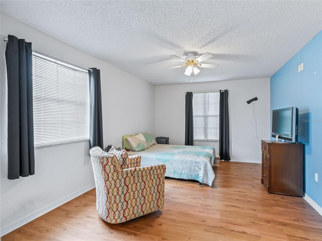 8850 Southwest 116th Place Road Ocala, FL 34481 - Photo 21 of 53 a living room with couches and a chandelier