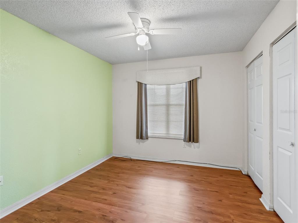 8850 Southwest 116th Place Road Ocala, FL 34481 - Photo 26 of 53 wooden floor in an empty room with a window
