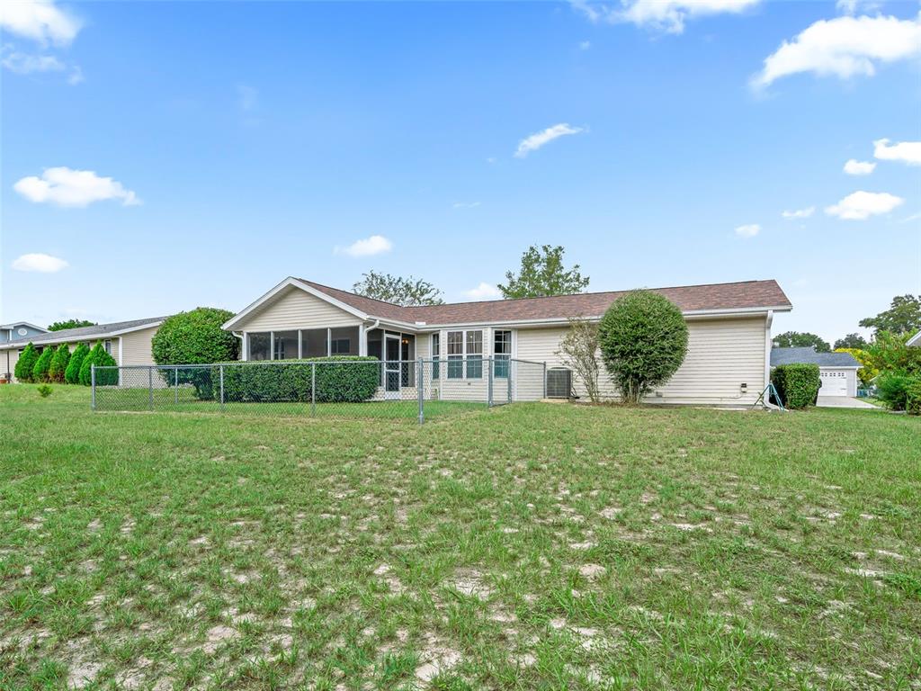 8850 Southwest 116th Place Road Ocala, FL 34481 - Photo 37 of 53 a front view of a house with garden