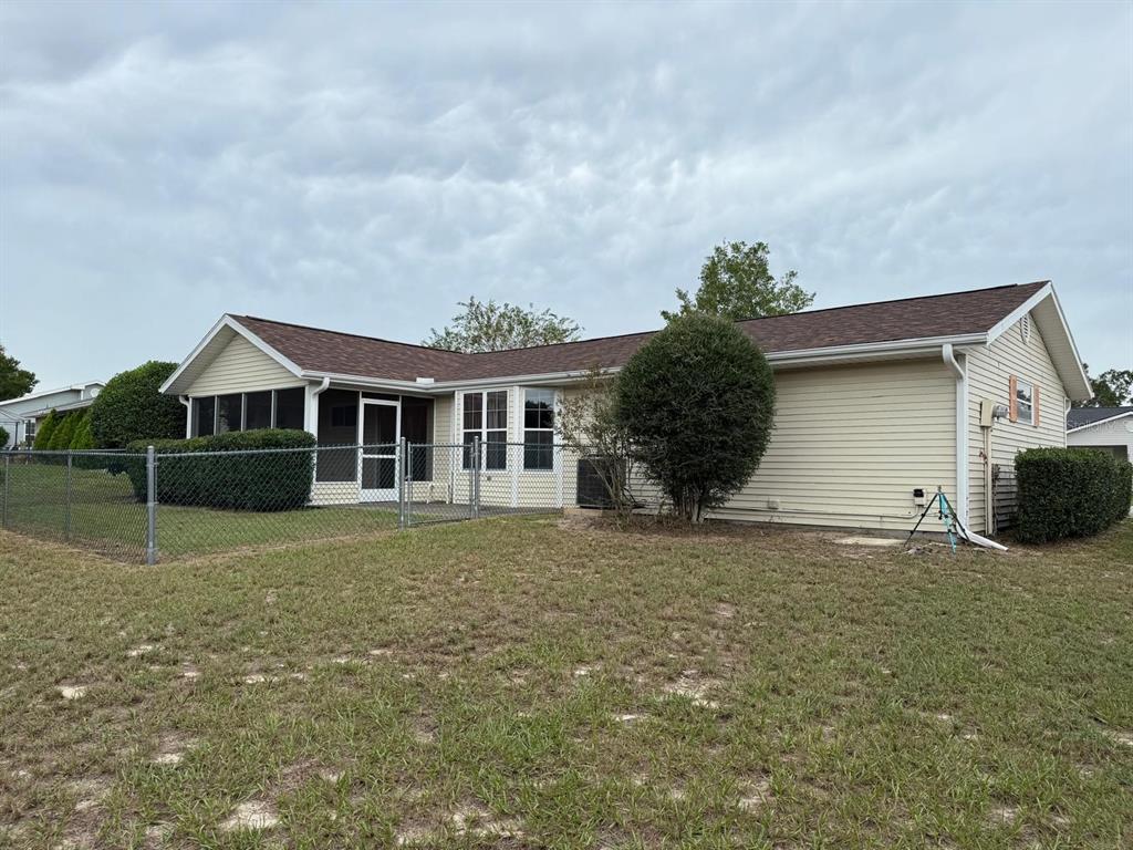 8850 Southwest 116th Place Road Ocala, FL 34481 - Photo 5 of 53 a front view of a house with a yard