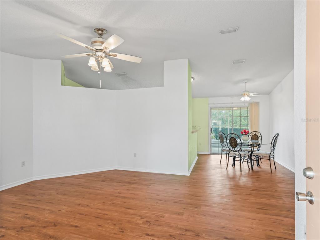 8850 Southwest 116th Place Road Ocala, FL 34481 - Photo 8 of 53 a view of a dining room with furniture and chandelier
