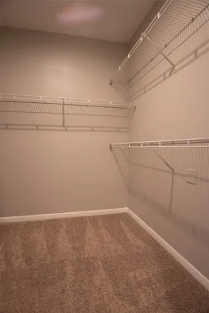 a view of a room with racks on the wall