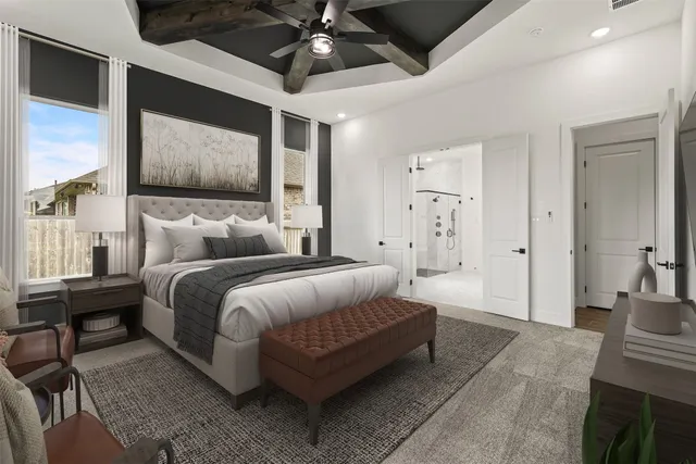 a double bed in a spacious bedroom next to a window