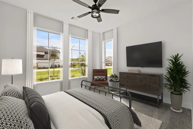 a bedroom with a bed a large window and flat screen tv